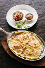 mexican cheese quesadilla with salsa and chilli sauce