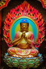 Obraz premium Buddha image that is carved of wood. Buddha sitting in a lotus flower, and his hands is in various positions mudras.