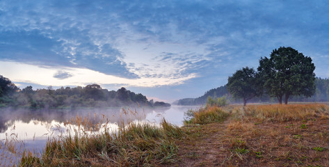 Foggy river in the autumn morning