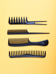 four black combs