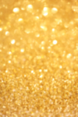 ..Golden glitter Christmas abstract background with defocused sp