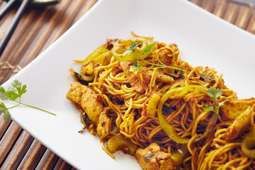 sweet chili noodles in a white serving plate with chopsticks, bright colors, modern style