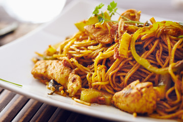 sweet chili noodles in a white serving plate with chopsticks, bright colors, modern style