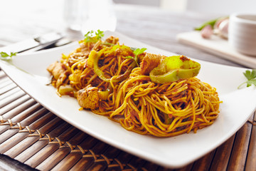 sweet chili noodles in a white serving plate with chopsticks, bright colors, modern style