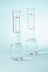 Vodka glass on a blue background