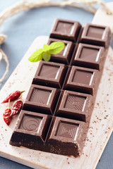 Dark chocolate on a white chopping board, light and bright colors