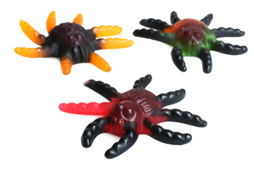 Jelly sweets in the form of spiders isolated on white background.