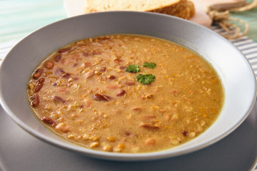 bean and spelt soup on a wooden table, bright colors