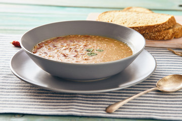 bean and spelt soup on a wooden table, bright colors