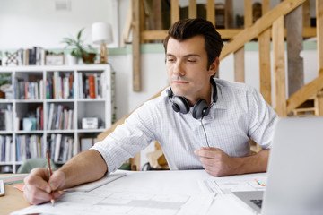 Fototapeta premium Young businessman in office