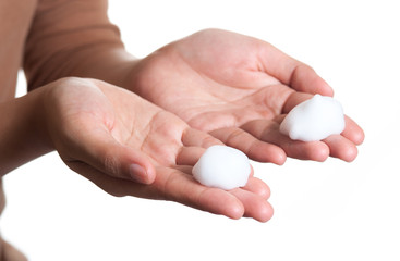 Shave foam (cream) on woman's hands