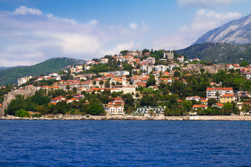Obraz premium Old small town on sea coast. Herceg Novi - coastal town in Montenegro located at the entrance to the Bay of Kotor. Tourist travelling attraction