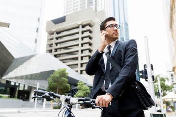 Young businessmen with a bike