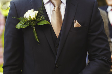 Stylish groom in dark suit