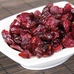 Dried cranberries in white bowl