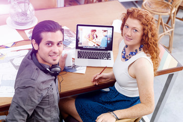 Two young people in office