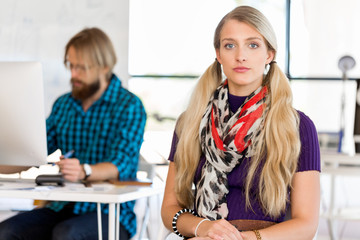 Obraz premium Young woman in office