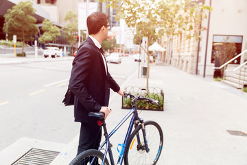 Young businessmen with a bike