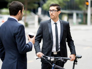 Young businessmen with a bike