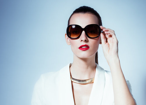 Fashion portrait of woman wearing sunglasses. 