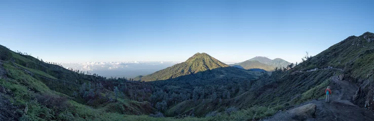 Fotobehang ijen volcano at sunrise panorama landscape view © Andrea Izzotti