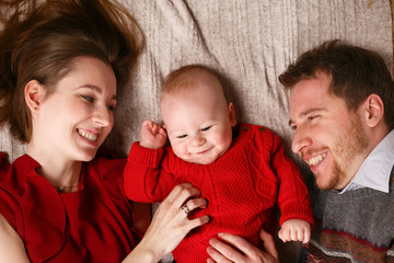 Joyful young family with a baby