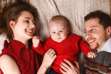 Joyful young family with a baby