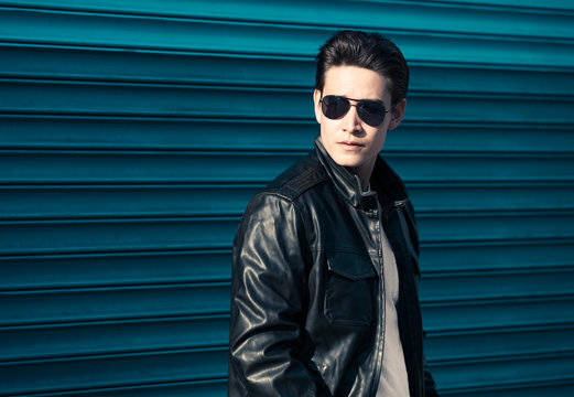 Handsome Man Wearing Leather Jacket And Sunglasses. 