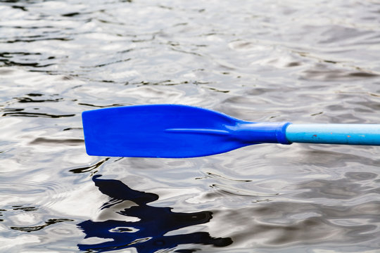 paddle blade over the water during rowing boat