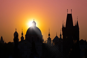 Charles bridge, Old Town Bridge Tower (UNESCO), Old Town, Prague, Czech Republic - skyline silhouette with rising sun