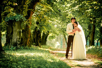 happy bride and groom on a walk in beautiful forest