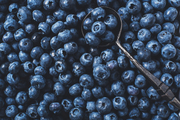 Blueberries on vintage wooden black background top view, healthy food on dark table mockup, berry for smoothie isolated on rustic country board, fresh nutrition closeup, copy space for text design