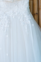Fototapeta na wymiar Close up Wedding dress of the bride. Curve shape of dress for bridal in wedding party.