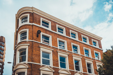Obraz premium orange apartment building with brick facade