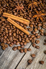 Coffee, cinnamon and Damian on wooden background