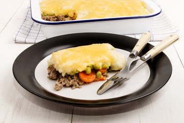 irish shepherds pie with melted cheddar cheese on a plate