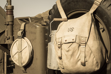 US military bag and gasoline jerrycan on a jeep expostion