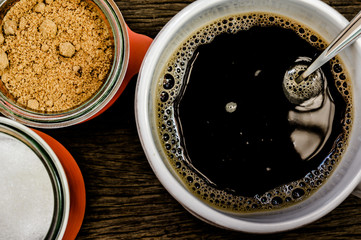 cup of coffee on the wooden table background