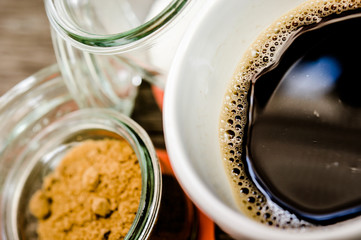 cup of coffee on the wooden table background