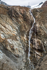 Waterfall in Austria mountains near glacier