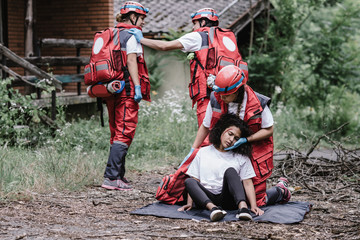 Fototapeta na wymiar Paramedics rescuing disaster victim