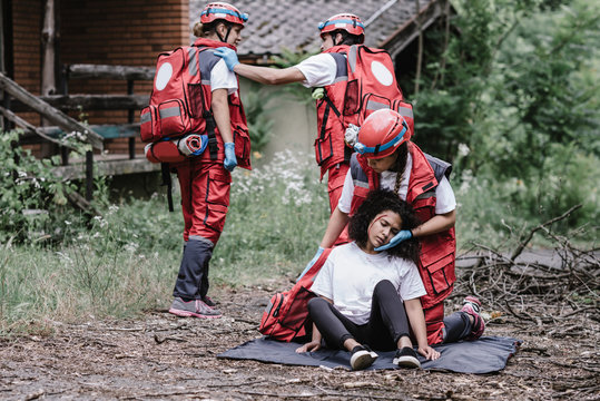 Paramedics rescuing disaster victim