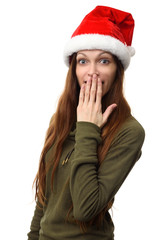 Surprised woman wearing a christmas santa hat