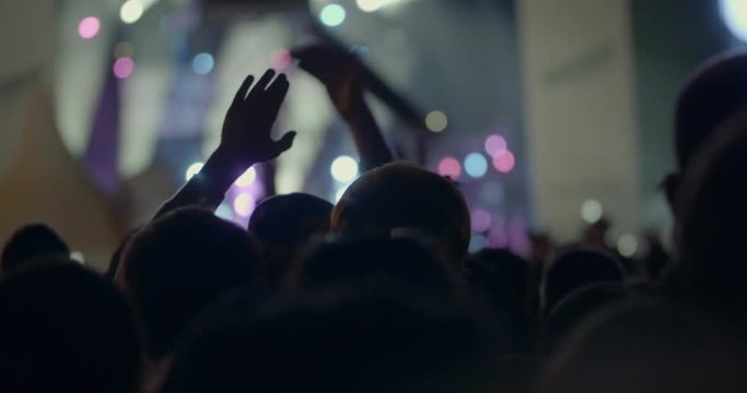 In MSU, Moscow on a concert We are together of musical group Kino crowd of people clap over head. Entertainment and rest
