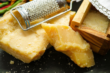 Parmesan cheese. Grated Parmesan cheese. Olive Wood Parmesan Cheese