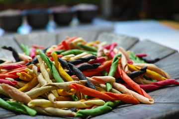 Traditional colorful Italian dried homemade pasta fusilli with e