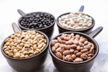 Beans variety/ different types of beans on black wooden background