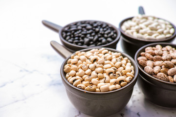 Beans variety/ different types of beans on black wooden background