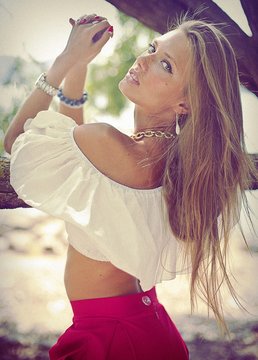 beautiful girl in a white blouse and red skirt