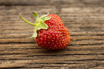 Strawberry on rustic wooden background. Selective focus